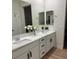 Elegant bathroom with double vanity, stylish mirrors, and ample counter space with updated cabinets at 5230 Lissome Lily Ct, Las Vegas, NV 89139