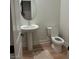 Well-lit powder room featuring pedestal sink, modern fixtures, and neutral decor at 5230 Lissome Lily Ct, Las Vegas, NV 89139