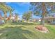 Lush backyard with well-maintained grass and mature trees, offering a peaceful and private outdoor space at 5421 Painted Mirage Rd, Las Vegas, NV 89149