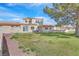 Backyard with grass and partial desert landscaping, and an outdoor patio area at 5421 Painted Mirage Rd, Las Vegas, NV 89149