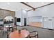 Inviting clubhouse with stone wall accents, ample seating, and a view of the golf course at 5421 Painted Mirage Rd, Las Vegas, NV 89149