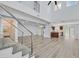 Bright living room with vaulted ceilings, modern flooring, and an open floor plan at 5421 Painted Mirage Rd, Las Vegas, NV 89149