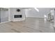 Modern living room featuring sleek floors, a fireplace, and stylish decor at 5421 Painted Mirage Rd, Las Vegas, NV 89149