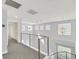 Light-filled loft area with modern railings and plenty of natural light at 5421 Painted Mirage Rd, Las Vegas, NV 89149