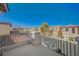 Balcony view of a neighborhood featuring attractive homes and blue skies at 5861 Secret Island Dr, Las Vegas, NV 89139