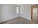 Bedroom featuring wood-style flooring, window, and neutral paint at 5861 Secret Island Dr, Las Vegas, NV 89139