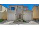 Charming two-story home featuring a tile roof, balcony and a two-car garage at 5861 Secret Island Dr, Las Vegas, NV 89139