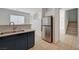 Open kitchen featuring stainless steel appliances and a breakfast bar at 5861 Secret Island Dr, Las Vegas, NV 89139