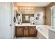 Bright bathroom with a double vanity, soaking tub, and neutral color scheme at 5958 W Agate Ave, Las Vegas, NV 89139