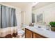 Bathroom featuring a tub shower with neutral colored walls and accents at 5958 W Agate Ave, Las Vegas, NV 89139