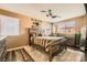 Inviting bedroom with a rustic wood bed frame and plush decor at 5958 W Agate Ave, Las Vegas, NV 89139