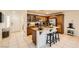 Functional kitchen offers an island with bar stools, ample cabinet space, and modern appliances at 5958 W Agate Ave, Las Vegas, NV 89139