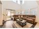 Bright, open living room with high ceilings, hardwood floors, and sliding doors leading to the backyard at 5958 W Agate Ave, Las Vegas, NV 89139