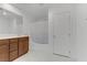 Bright bathroom featuring double sinks, wood cabinets, and a shower/tub combo at 7256 Saxby Ave, Las Vegas, NV 89113