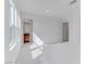 Sunlight streams into a bedroom with an ensuite bathroom, enhancing the space and feel at 7256 Saxby Ave, Las Vegas, NV 89113