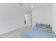 The carpeted bedroom showcases a cozy bed and a door to another room at 7256 Saxby Ave, Las Vegas, NV 89113