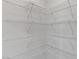 Large closet with white racks and shelving, providing ample storage solutions at 7256 Saxby Ave, Las Vegas, NV 89113