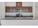 Kitchen view showcasing granite countertops, stainless steel appliances, and a functional layout at 7256 Saxby Ave, Las Vegas, NV 89113