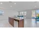 Open-concept kitchen with granite countertops and direct view into the living room at 7256 Saxby Ave, Las Vegas, NV 89113