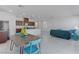 Open floor plan blending the dining area, living room, and kitchen for seamless living at 7256 Saxby Ave, Las Vegas, NV 89113