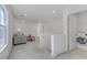 Open living space features a comfortable couch, a stylish coffee table, and a washer and dryer in the background at 7256 Saxby Ave, Las Vegas, NV 89113