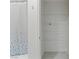 Walk-in closet with wire shelving and a shower/tub combo with curtain at 7256 Saxby Ave, Las Vegas, NV 89113