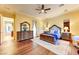 Bedroom features a large dresser, queen-size bed, hardwood floors, and neutral-colored rug at 8209 Chapelle Ct, Las Vegas, NV 89131