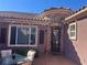 Outdoor seating on a tiled courtyard with a private entrance at 8209 Chapelle Ct, Las Vegas, NV 89131