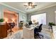 Home office with neutral walls, a ceiling fan, and two separate desk areas at 8209 Chapelle Ct, Las Vegas, NV 89131