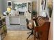 Bright home office featuring a desk, decorative shelving, and a classic wood piano at 8209 Chapelle Ct, Las Vegas, NV 89131