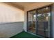 Small outdoor balcony with artificial turf and a sliding door to the interior at 101 Luna Way # 226, Las Vegas, NV 89145