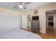 Bedroom featuring a ceiling fan, wood floors, and a dresser with mounted television at 101 Luna Way # 226, Las Vegas, NV 89145