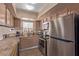 Well-equipped kitchen featuring stainless steel appliances and earth-tone cabinetry at 101 Luna Way # 226, Las Vegas, NV 89145