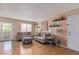 Bright living room with light hardwood floors, comfortable seating, and a decorative ottoman at 101 Luna Way # 226, Las Vegas, NV 89145