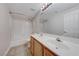 A well-lit bathroom showcases a double sink vanity, large mirror, and shower-tub combo at 1035 Dodger Blue Ave, Las Vegas, NV 89123