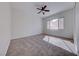 Cozy bedroom featuring a ceiling fan and natural light from the window at 1035 Dodger Blue Ave, Las Vegas, NV 89123