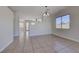 Spacious living area with tile flooring, natural light, and open access to adjacent rooms at 1035 Dodger Blue Ave, Las Vegas, NV 89123