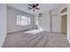 Bright, carpeted main bedroom with walk-in closet and large window at 1035 Dodger Blue Ave, Las Vegas, NV 89123