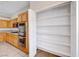 Pantry shelves provide ample storage alongside stainless steel appliances and granite countertops in the kitchen at 1035 Dodger Blue Ave, Las Vegas, NV 89123