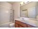 Bathroom featuring a shower/tub combo and a wood-tone vanity at 10431 Kitty Joyce Ave, Las Vegas, NV 89129