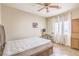 Bedroom featuring a desk and chair, a ceiling fan, and natural lighting at 10431 Kitty Joyce Ave, Las Vegas, NV 89129