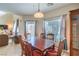 Cozy dining room with wood floors, traditional furniture, and plenty of natural light at 10431 Kitty Joyce Ave, Las Vegas, NV 89129