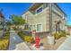 Exterior of property featuring a sidewalk, bushes, and neighboring buildings at 10431 Kitty Joyce Ave, Las Vegas, NV 89129