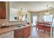 Kitchen with views of the living and dining areas, featuring a large sink and bar seating at 10431 Kitty Joyce Ave, Las Vegas, NV 89129