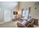 Comfortable living room featuring wood floors, neutral walls, and a contemporary design at 10431 Kitty Joyce Ave, Las Vegas, NV 89129