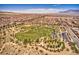 Wide aerial view of a residential community, park, and baseball field under a blue sky at 10725 Wrigley Field Ave, Las Vegas, NV 89166