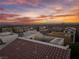 Aerial view showcasing a rooftop patio and surrounding neighborhood during sunset at 10725 Wrigley Field Ave, Las Vegas, NV 89166