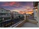 Evening balcony view overlooking neighborhood homes, with orange and purple sky at 10725 Wrigley Field Ave, Las Vegas, NV 89166