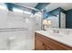 Modern bathroom featuring a glass enclosed shower, a single sink, and a large mirror at 10725 Wrigley Field Ave, Las Vegas, NV 89166