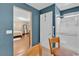 Bathroom featuring a shower with seating, white door, tan walls, and access to the bedroom at 10725 Wrigley Field Ave, Las Vegas, NV 89166